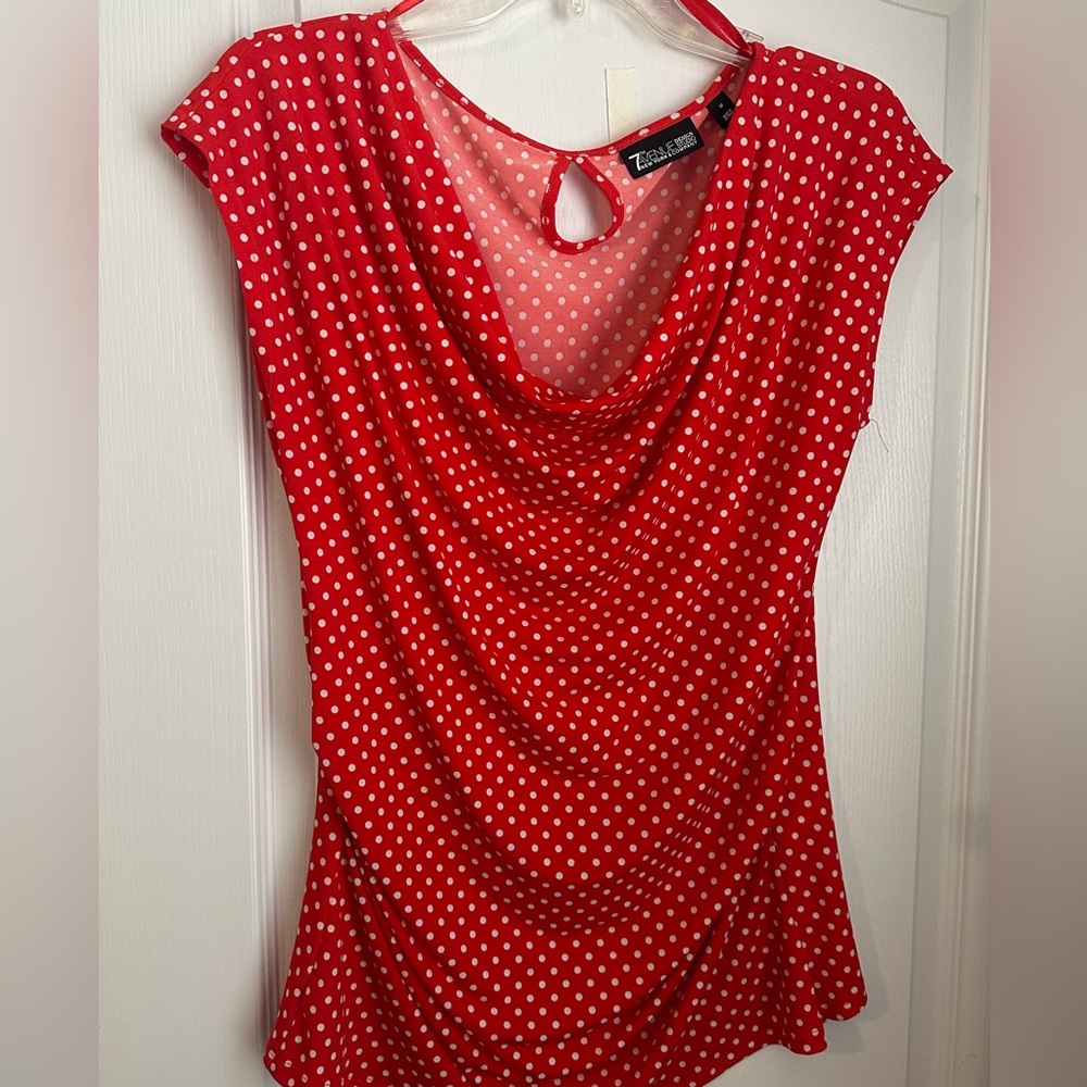 Red and white polka dots. Super cute shirt.